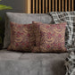 Decorative pillows with floral pattern on a gray sofa