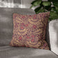 Decorative pillow with leaf pattern on a gray sofa