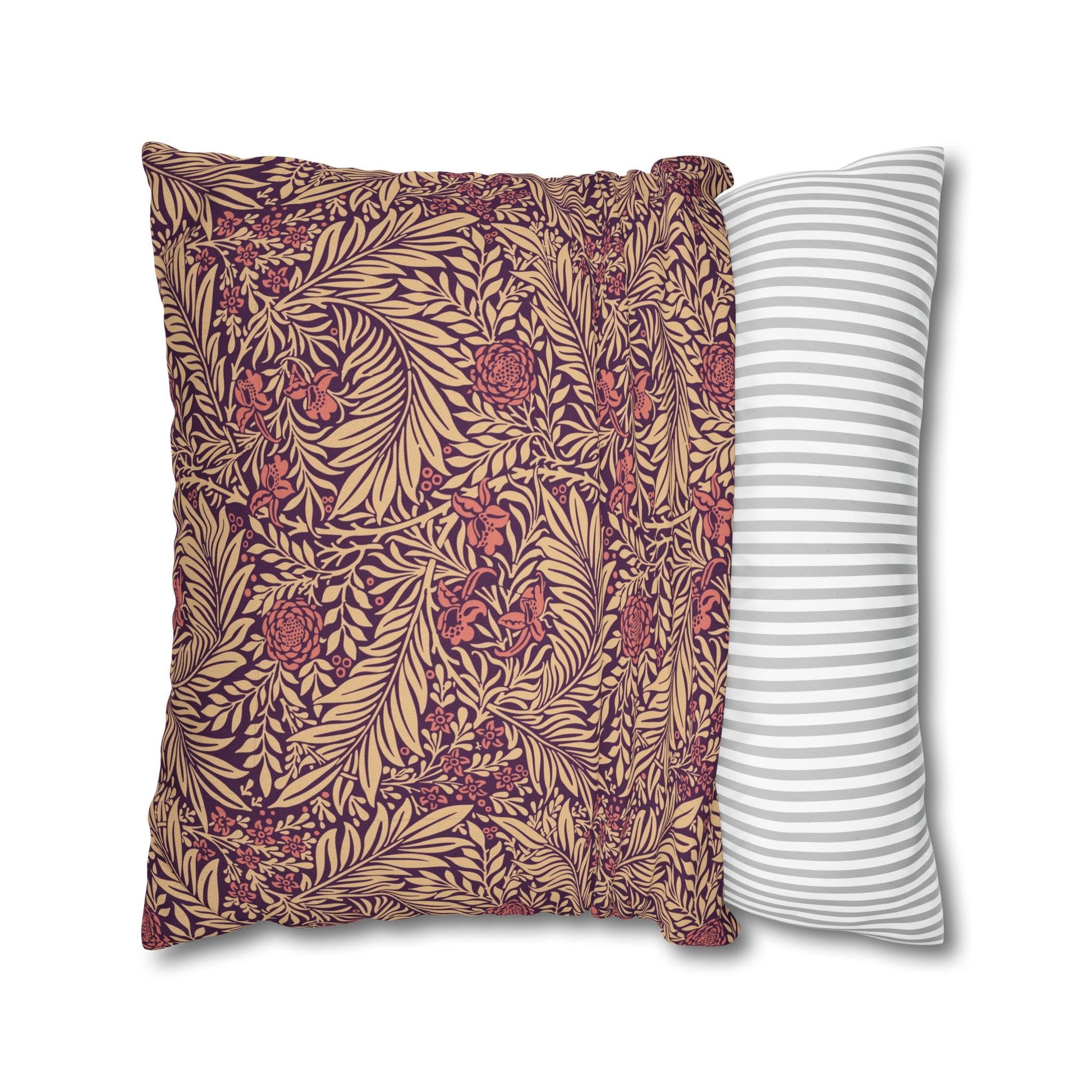 Two pillows, one with a floral pattern and the other with a striped pattern, on a white background.
