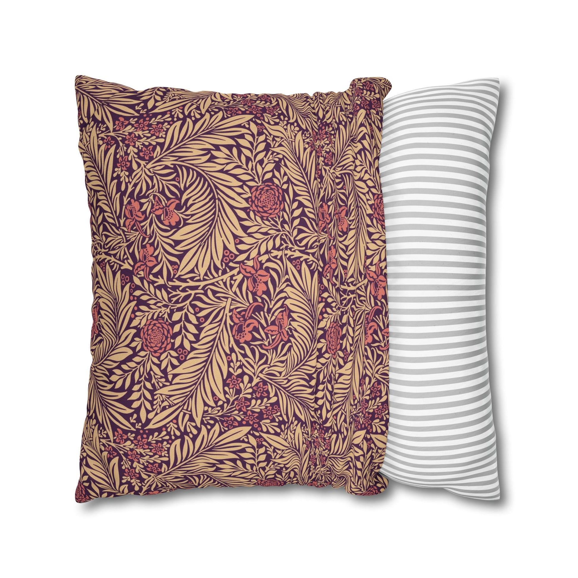 Two pillows, one with a floral pattern and the other with a striped pattern, on a white background.