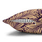 Decorative pillow with gold leaf pattern on a purple background