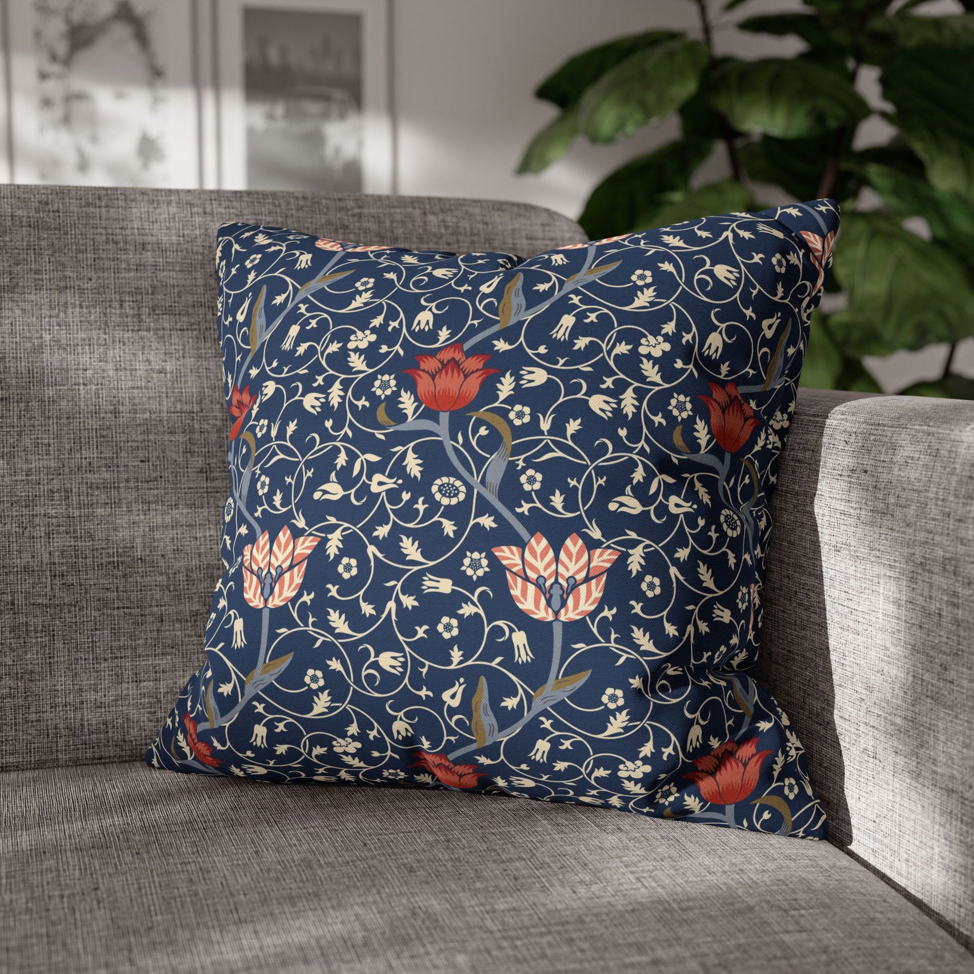 Decorative pillow with floral pattern on a gray sofa