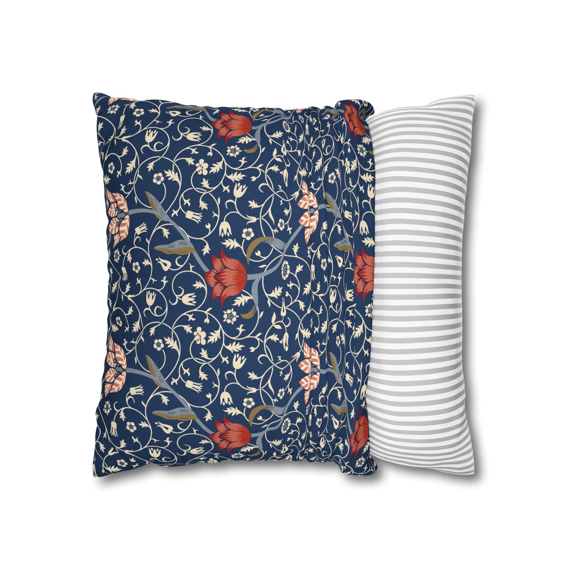 Floral-patterned pillow and a striped pillow on a white background