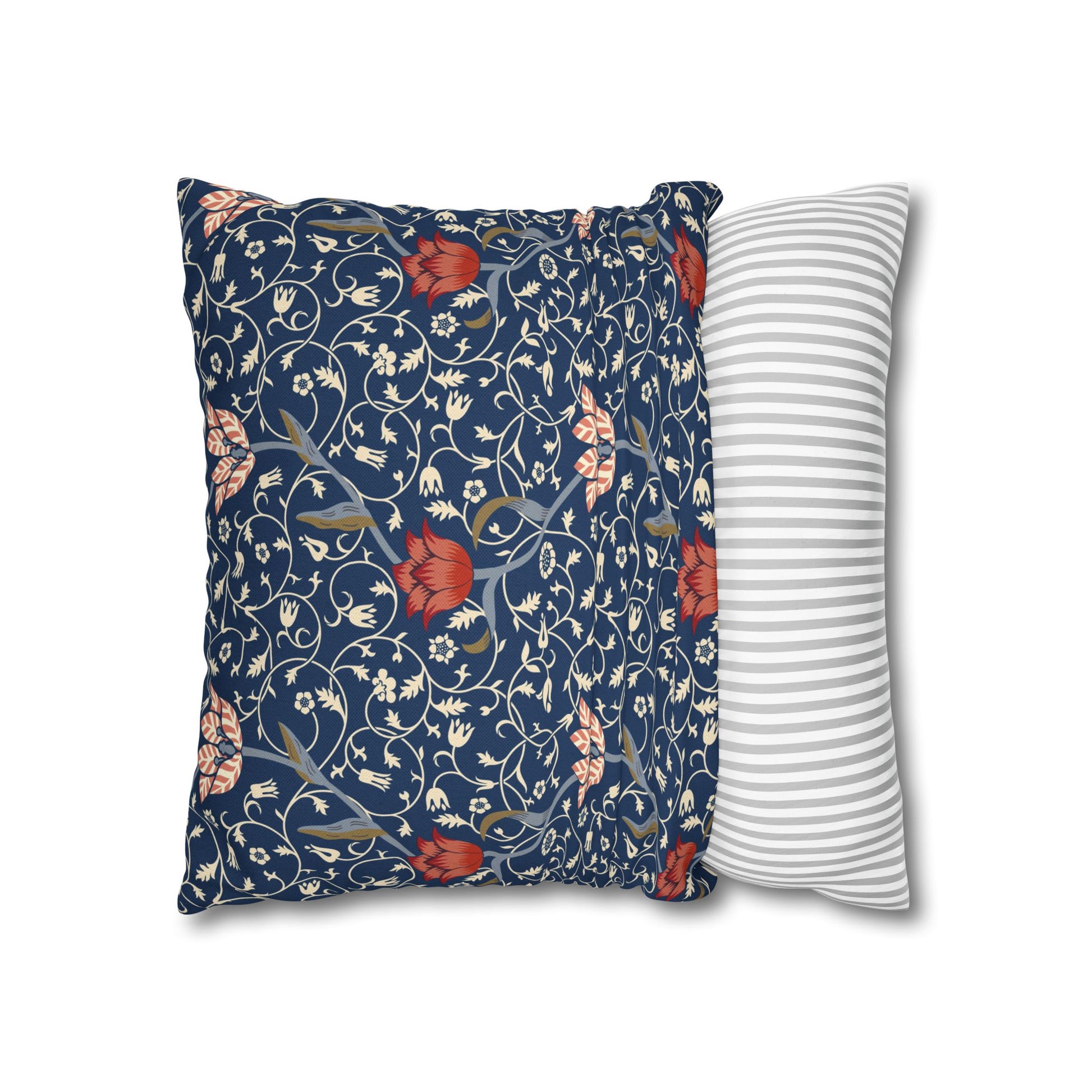 Floral-patterned pillow and a striped pillow on a white background