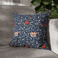 Decorative pillow with floral pattern on a gray sofa