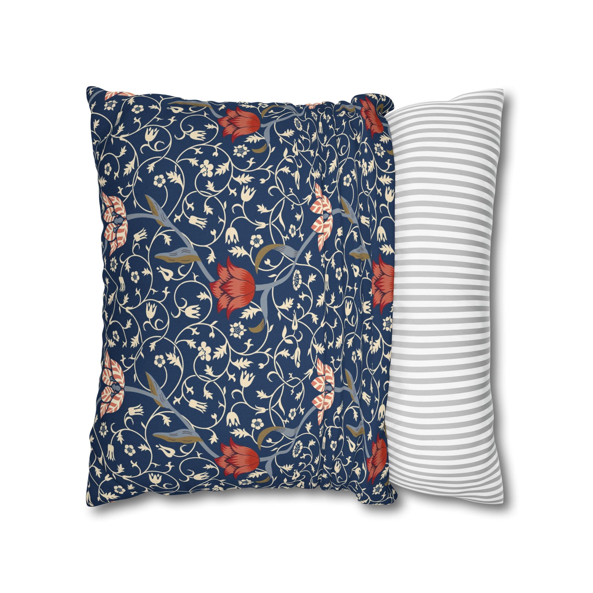 Two pillows, one with floral pattern and one with stripes, on a white background