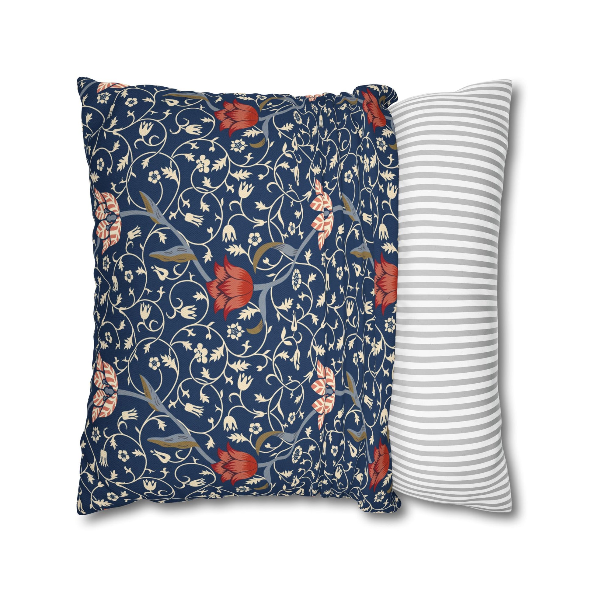Floral-patterned pillow and a striped pillow on a white background