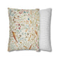 Two pillows, one with floral pattern and one with stripes, on a white background