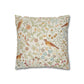 Decorative pillow with bird and floral pattern on a white background