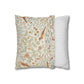 Two pillows, one with floral pattern and one with stripes, on a white background