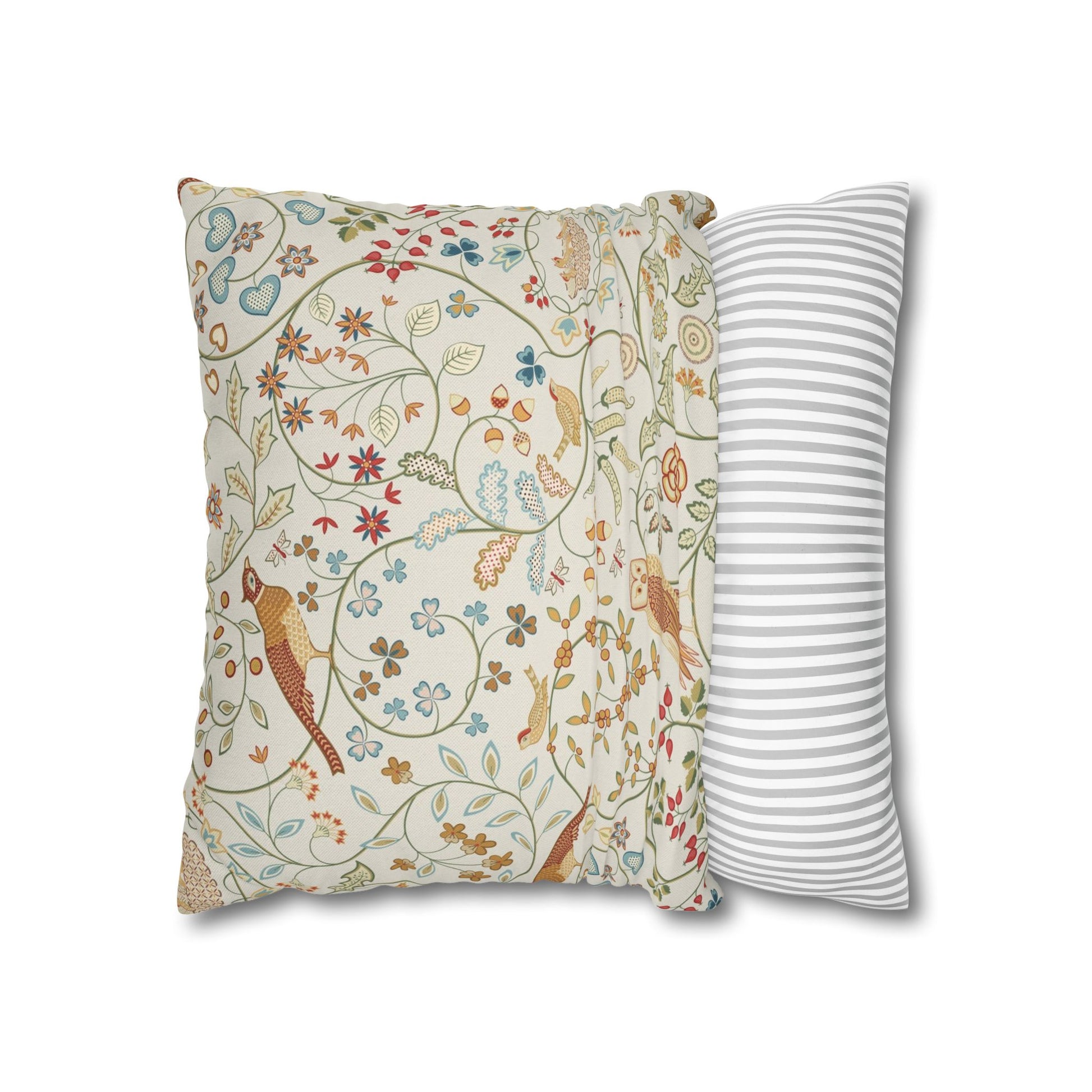 Two pillows, one with a floral pattern and the other with a striped pattern, on a white background.