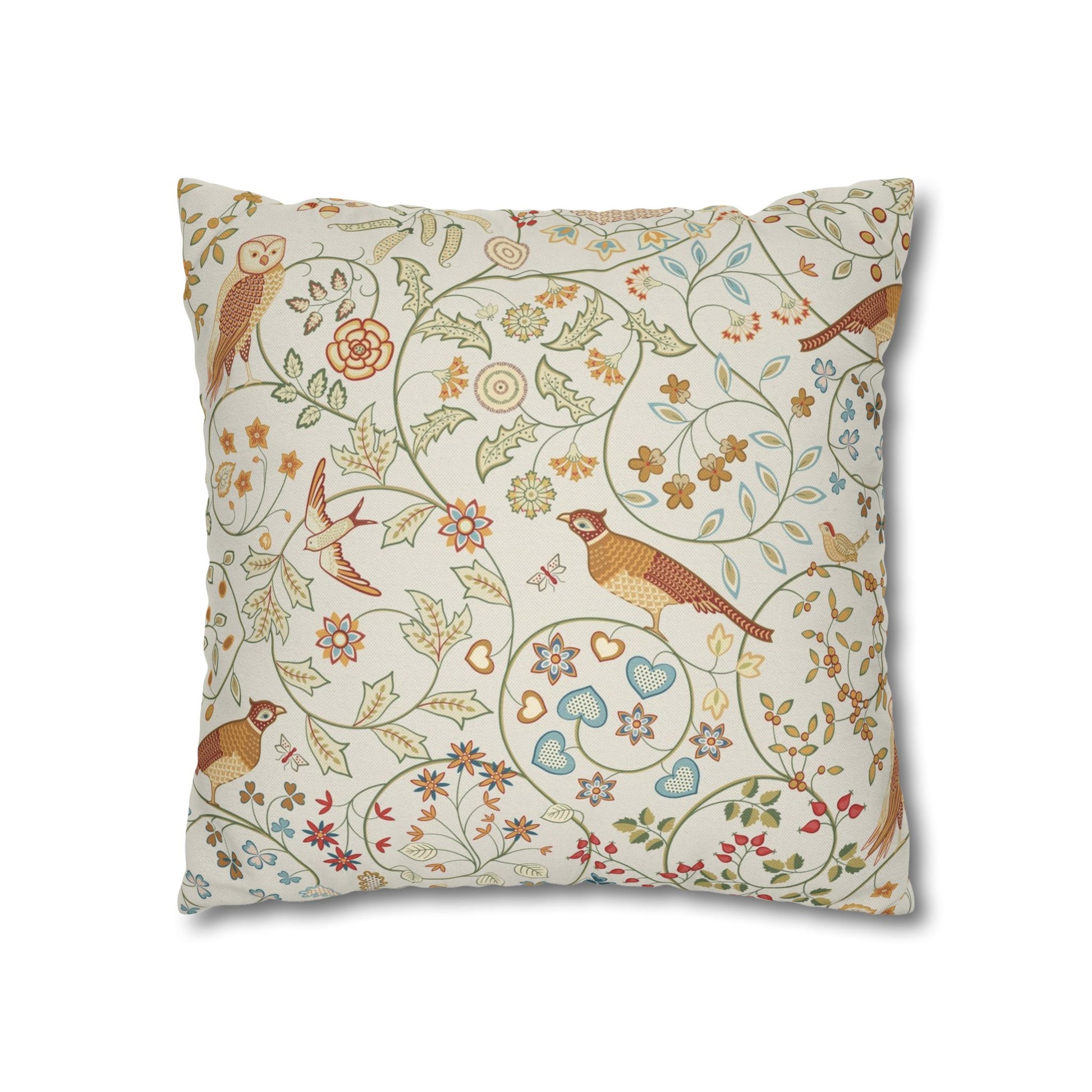 Decorative pillow with floral and bird pattern on a white background