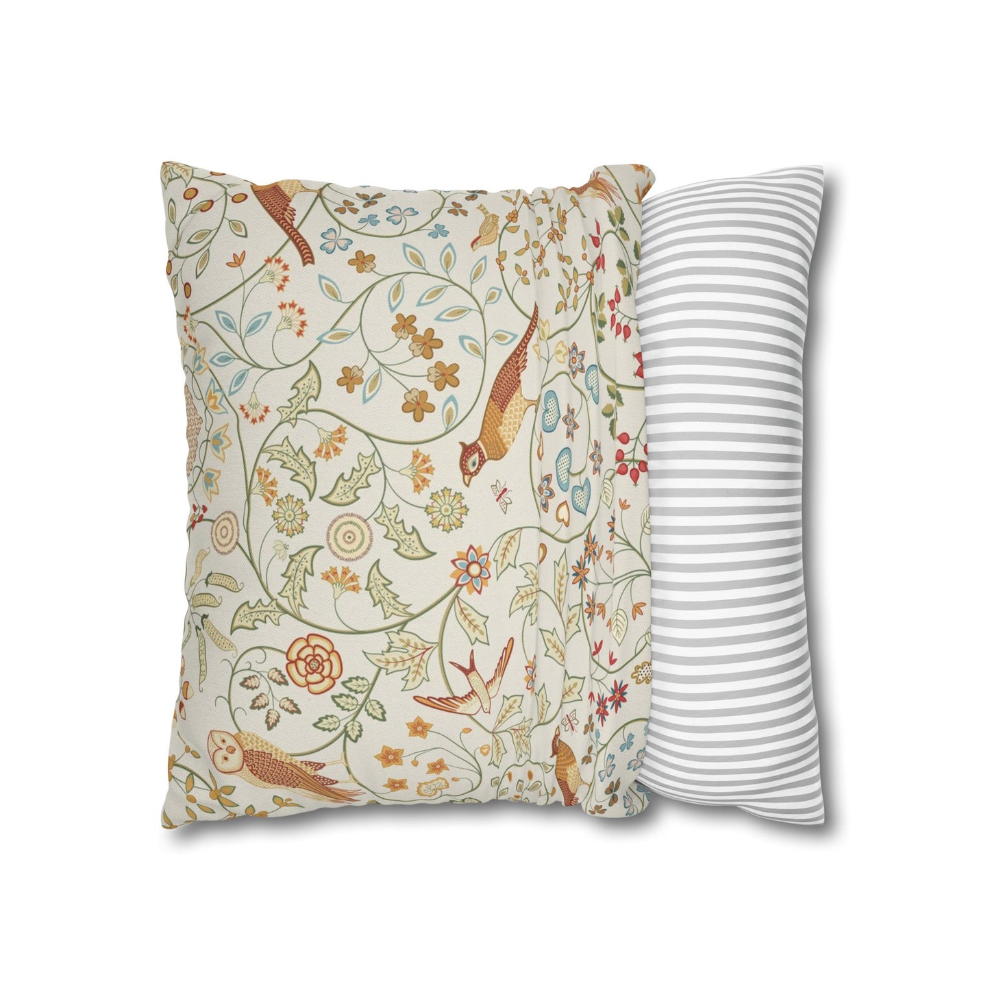 Two pillows, one with floral pattern and one with stripes, on a white background