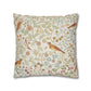 Decorative pillow with bird and floral pattern on a white background