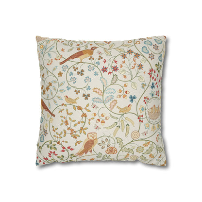 Decorative pillow with bird and floral pattern on a white background