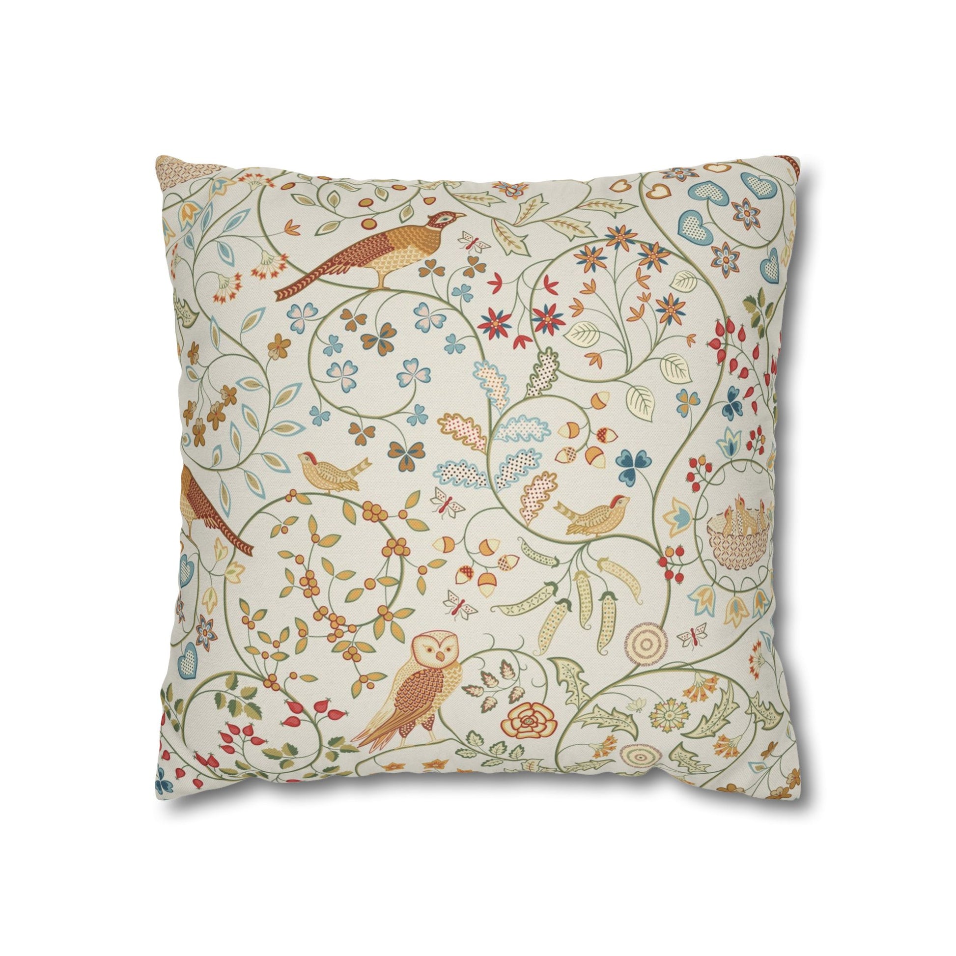 Decorative pillow with bird and floral pattern on a white background