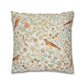 Decorative pillow with floral and bird pattern on a white background