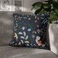 Decorative pillow with owl and floral pattern on a gray sofa