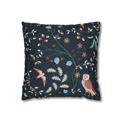 Decorative pillow with bird and owl design on a dark background