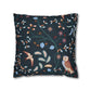 Decorative pillow with nature-themed pattern featuring birds and plants on a dark background