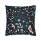 Decorative pillow with nature-themed pattern featuring birds and plants on a dark blue background.