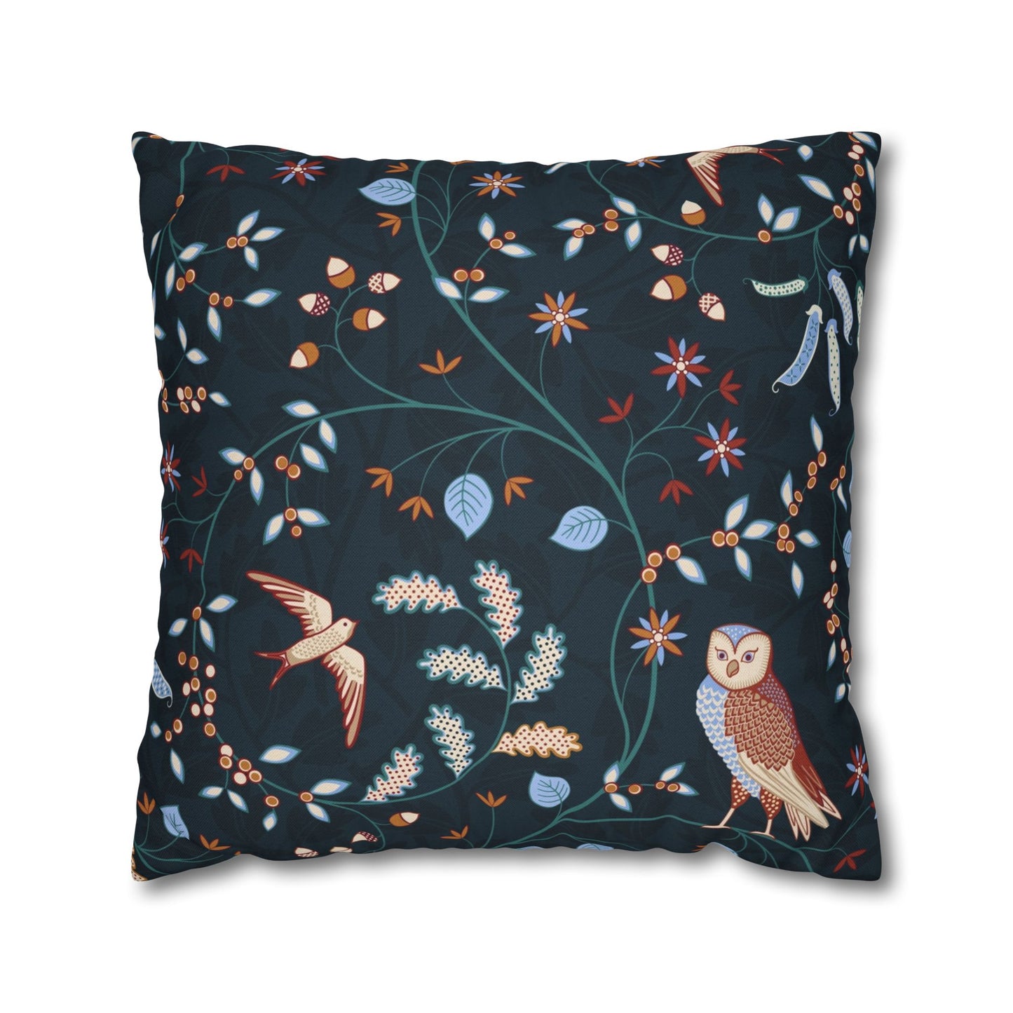 Decorative pillow with nature-themed pattern featuring birds and plants on a dark blue background.