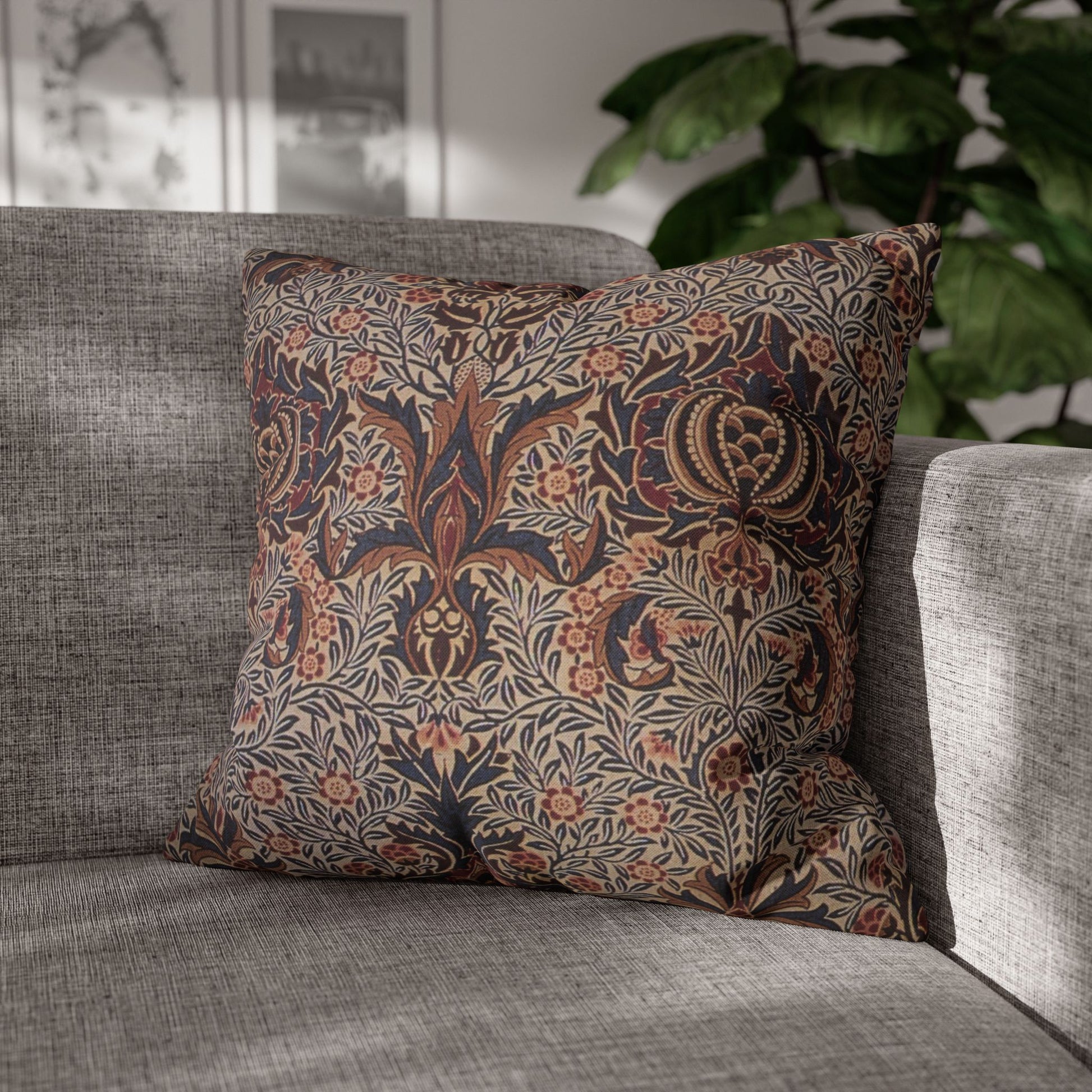 Decorative pillow with floral pattern on a gray sofa