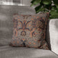 Decorative pillow with floral pattern on a gray sofa