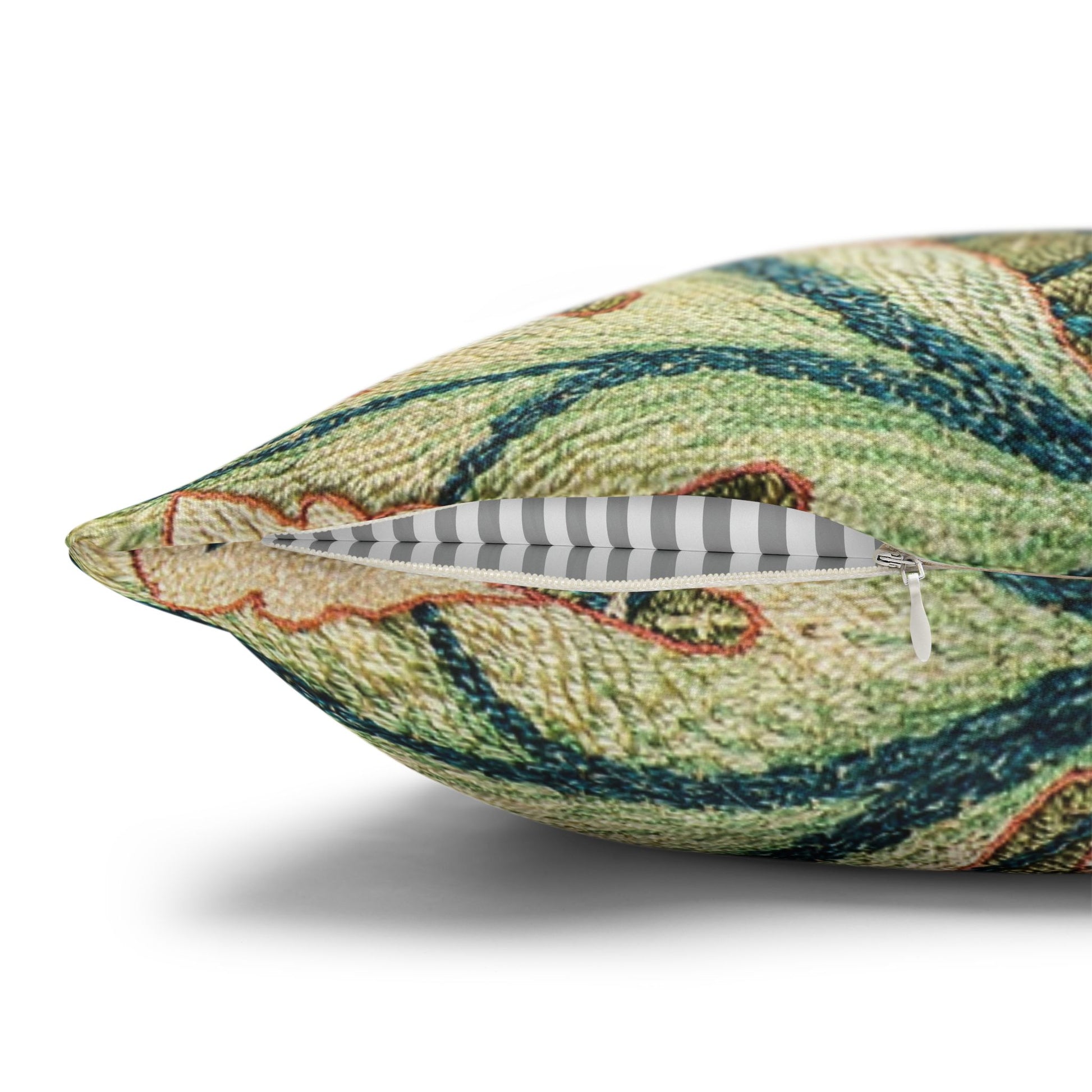 Decorative pillow with a green and beige pattern on a white background