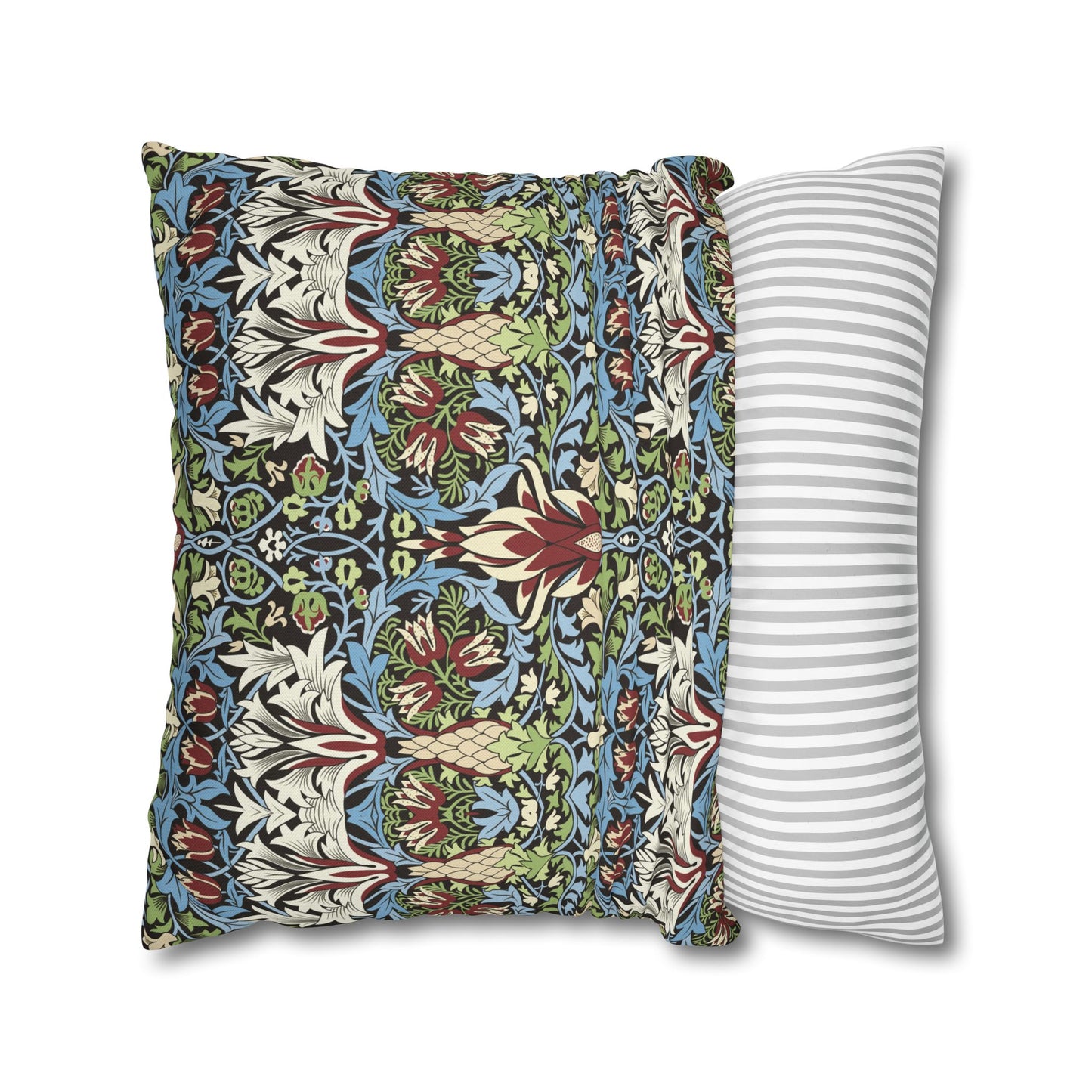 Two pillows, one with a floral pattern and the other with a striped pattern, on a white background - William Morris Snakeshead.