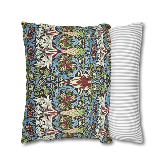 Two pillows, one with a floral pattern and the other with a striped pattern, on a white background - William Morris Snakeshead.