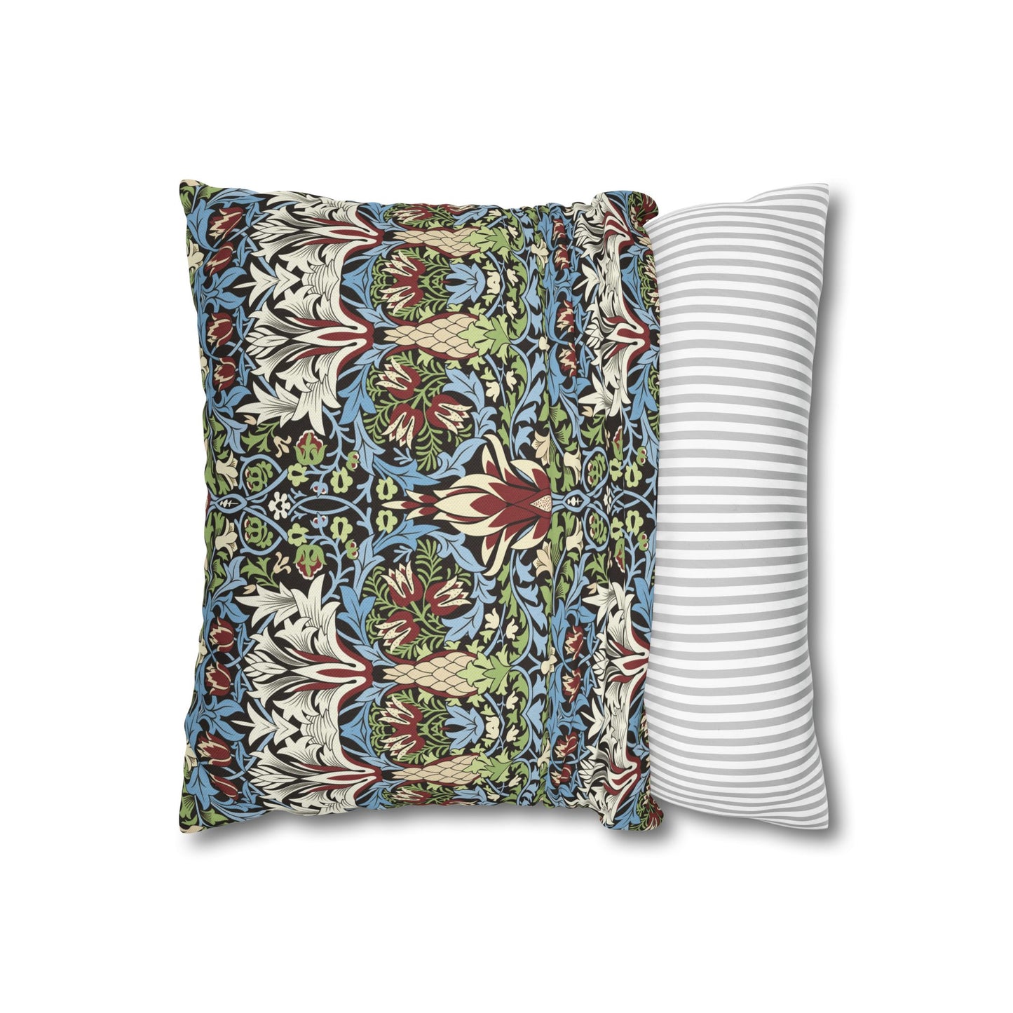 Decorative pillow with floral pattern next to a striped pillow on a white background - William Morris Snakeshead
