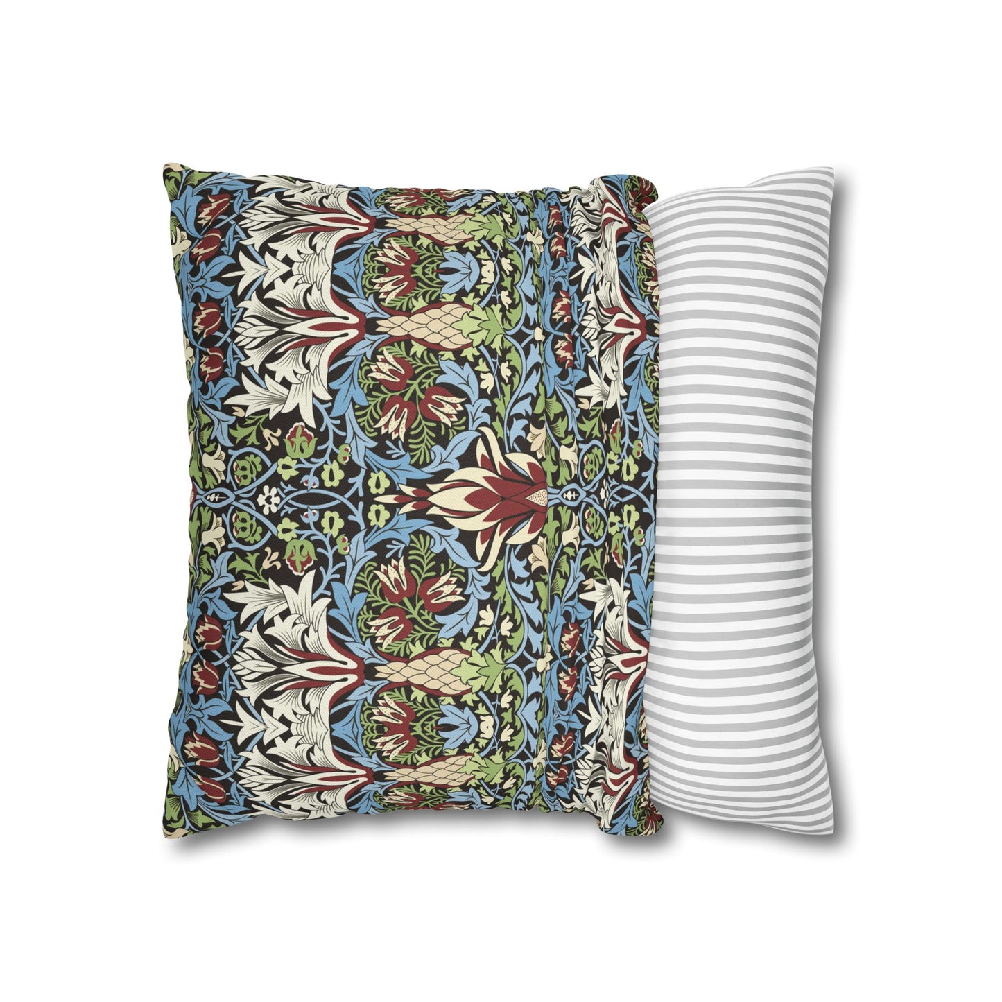 Decorative pillow with floral pattern next to a striped pillow on a white background - William Morris Snakeshead
