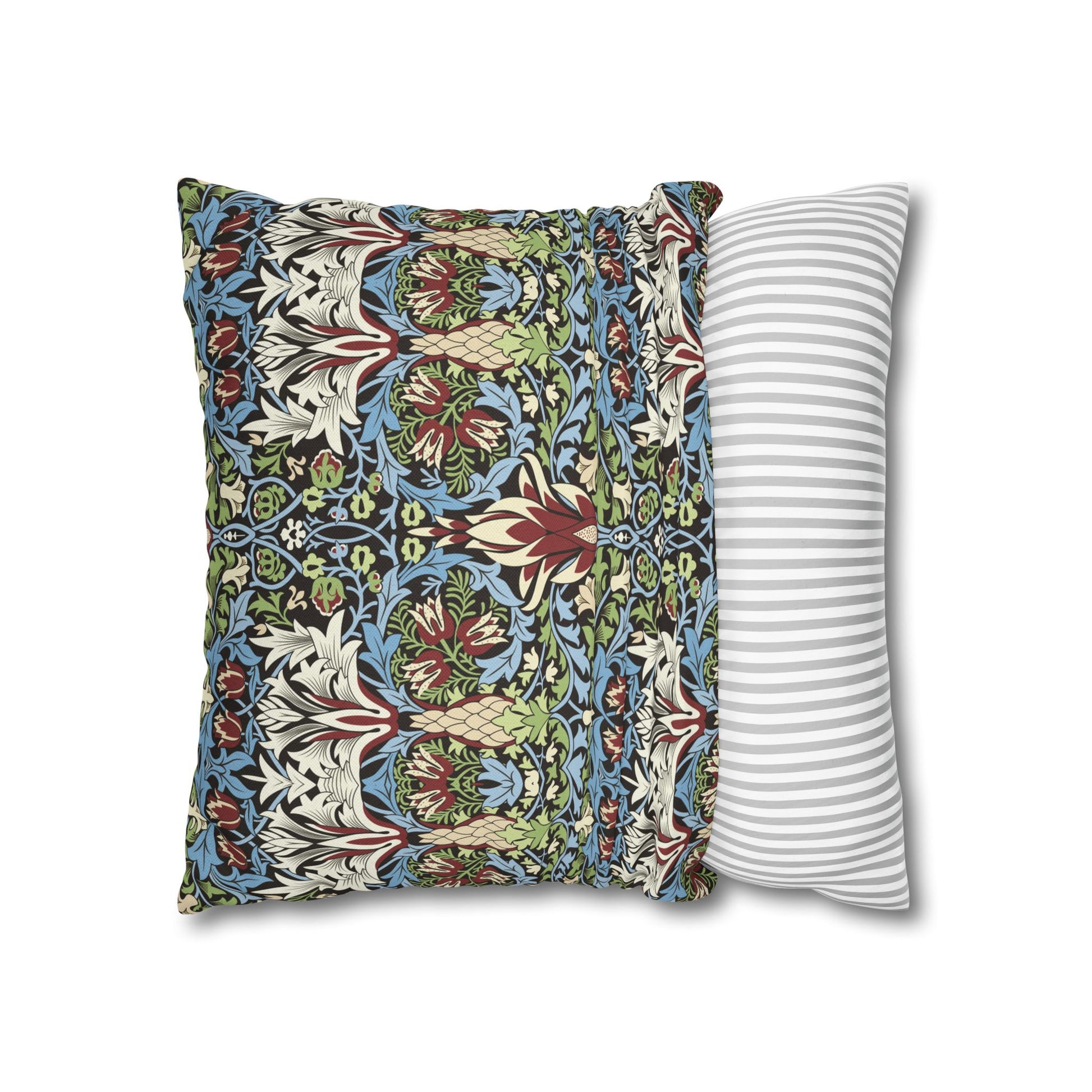 Two pillows, one with a floral pattern and the other with a striped pattern, on a white background - William Morris Snakeshead 