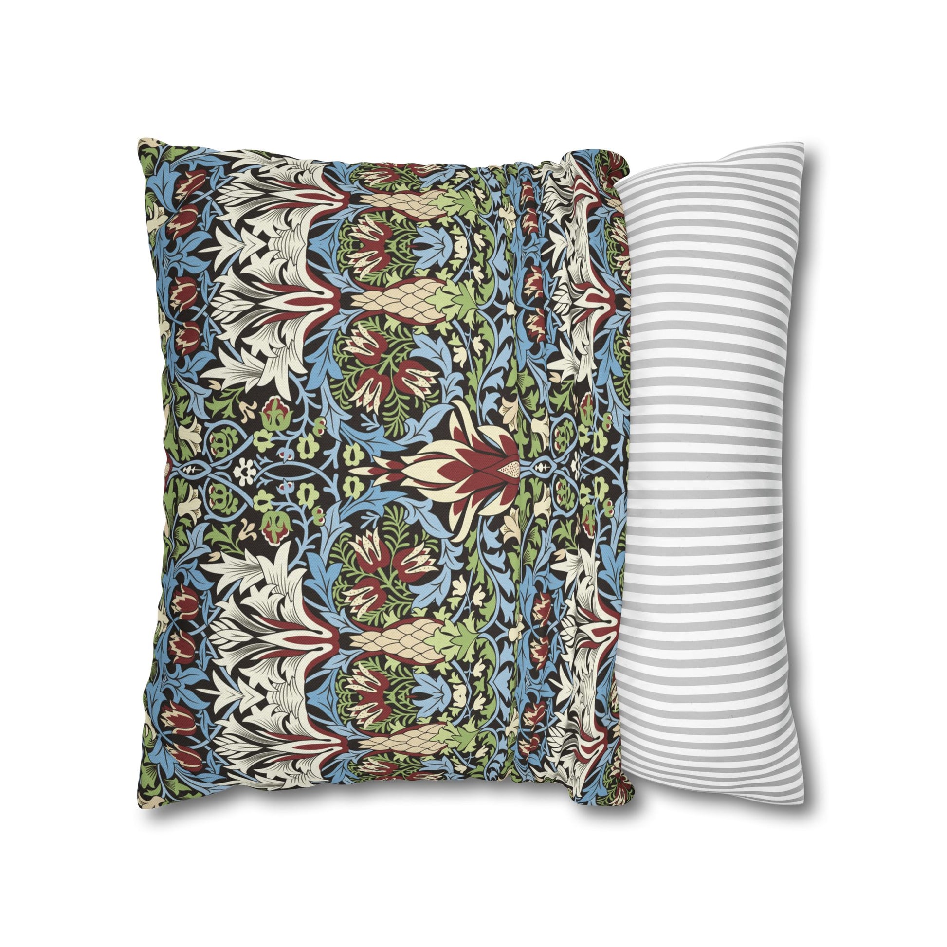 Two pillows, one with a colourful floral pattern and the other with a striped pattern, on a white background - William Morris Snakeshead
