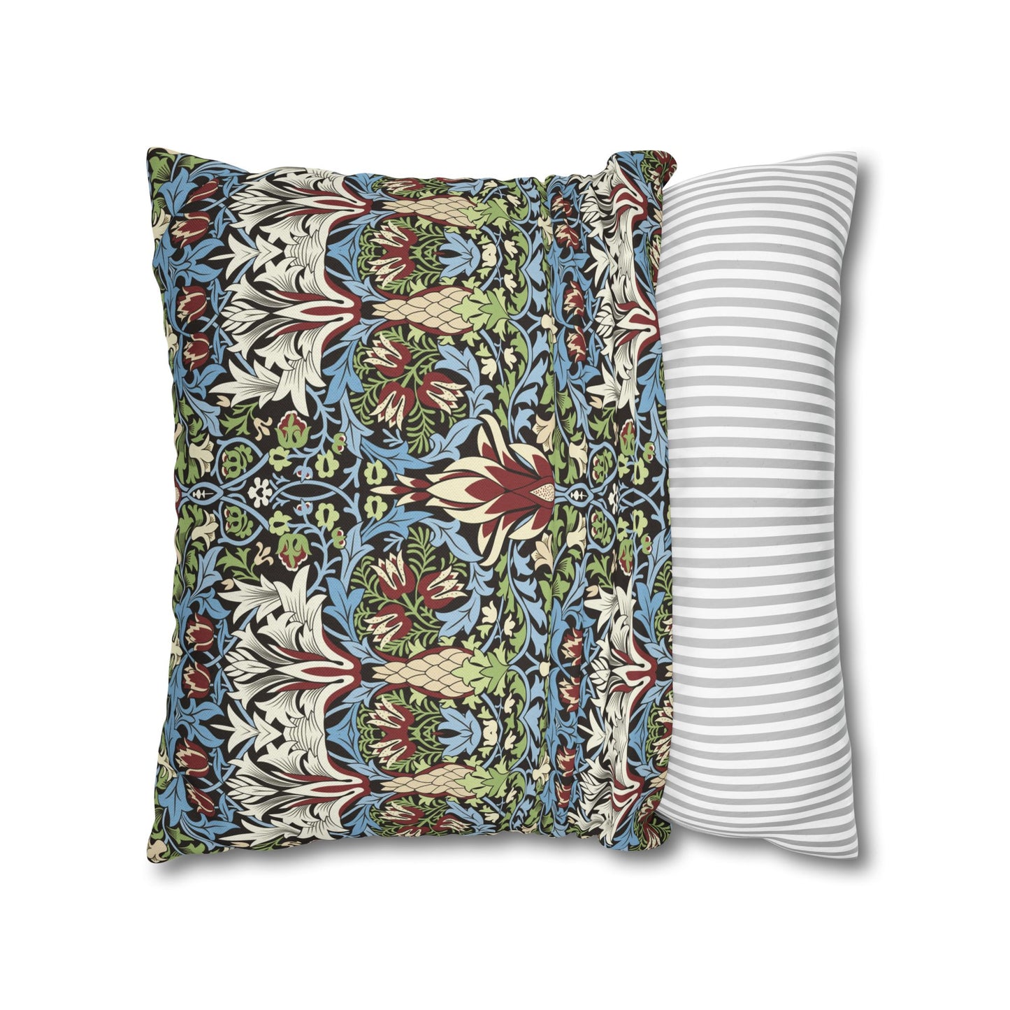 Decorative pillow with floral pattern next to a striped pillow on a white background - William Morris Snakeshead