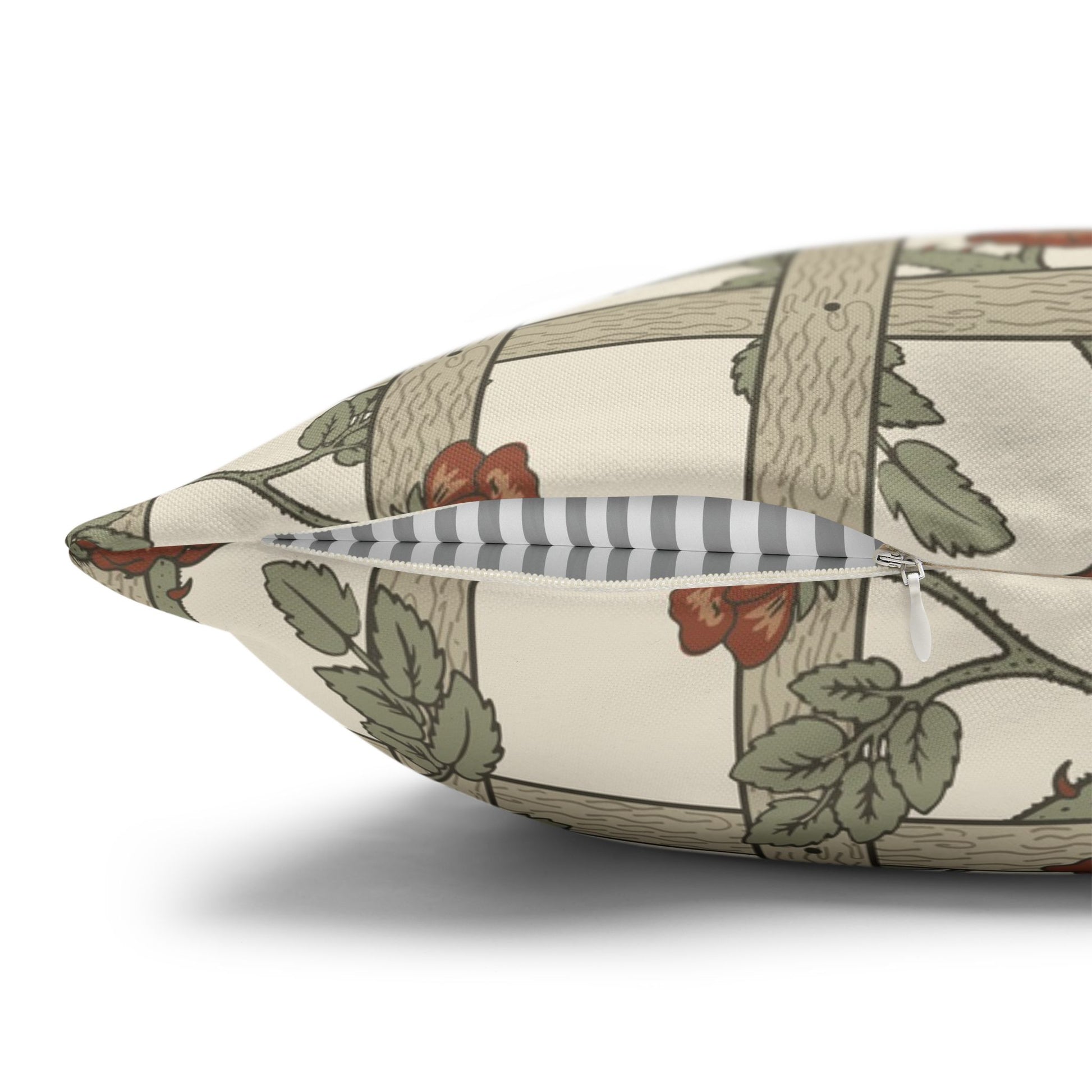 Decorative pillow with nature-themed pattern on a white background