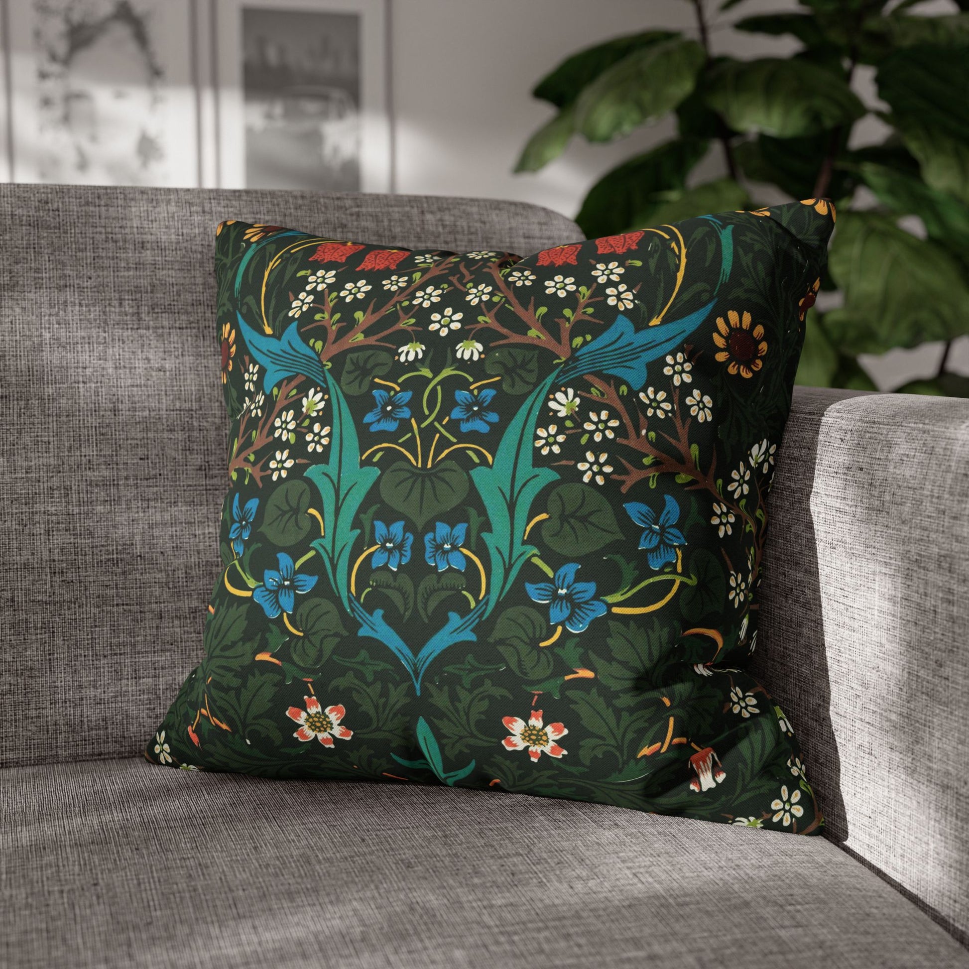 Decorative pillow with floral pattern on a gray sofa - William Morris Tulip
