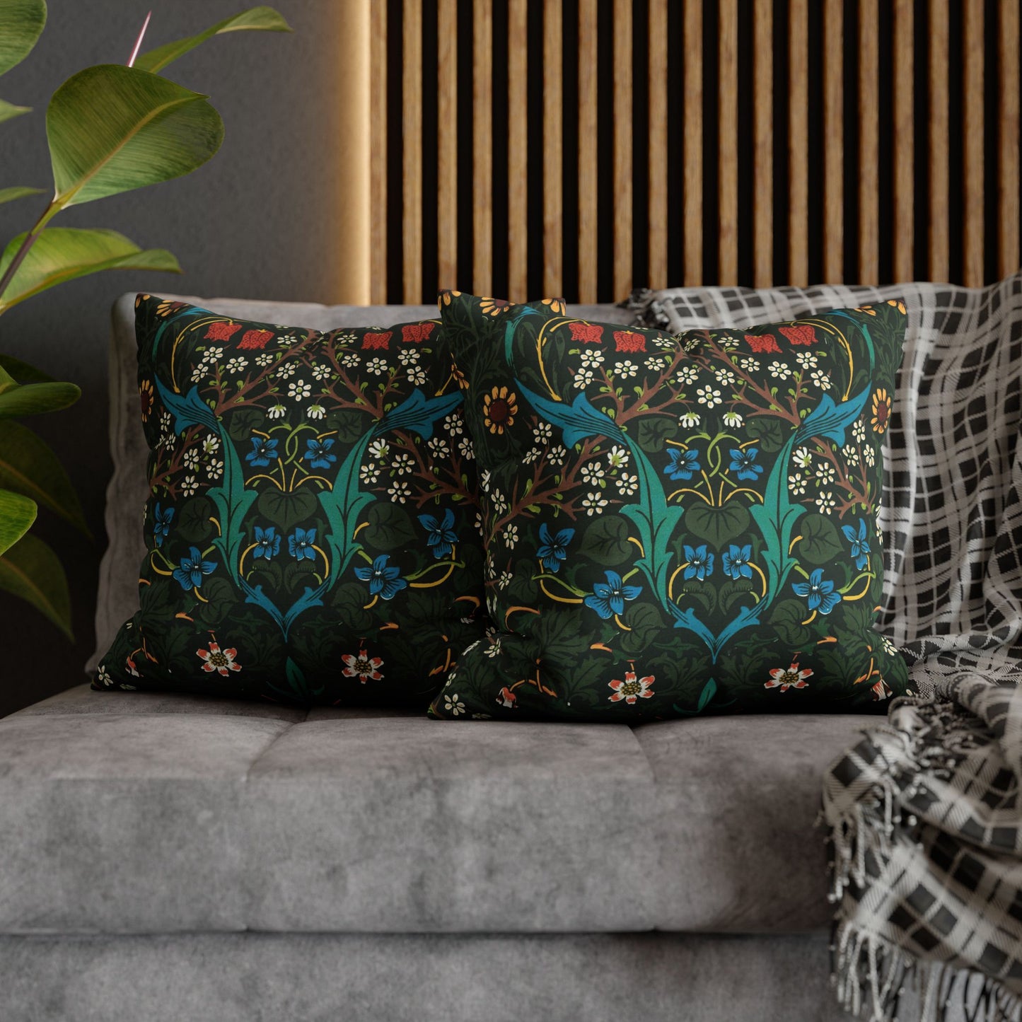 Decorative pillows with floral patterns on a gray sofa - William Morris Tulip