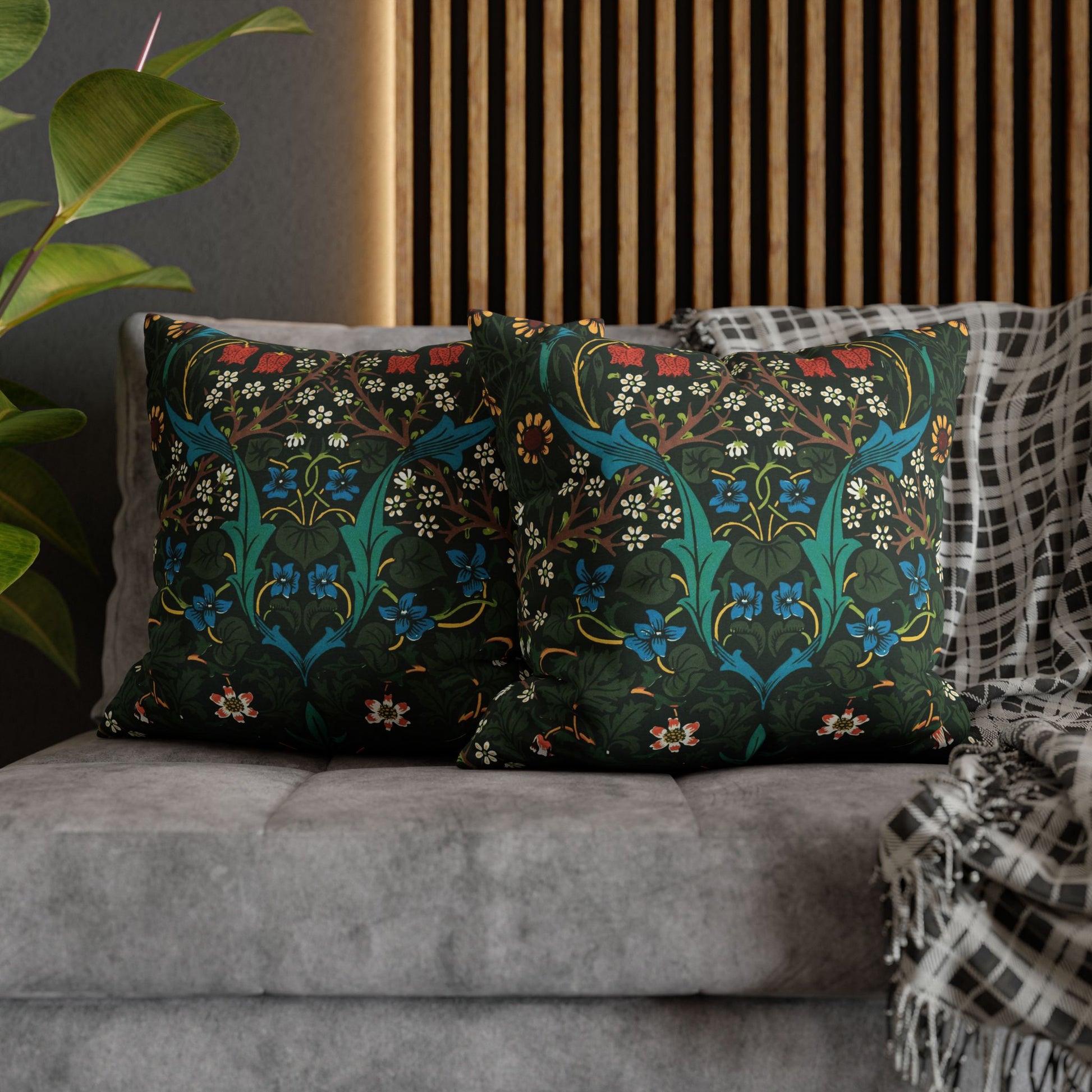 Decorative pillows with floral patterns on a gray sofa - William Morris Tulip