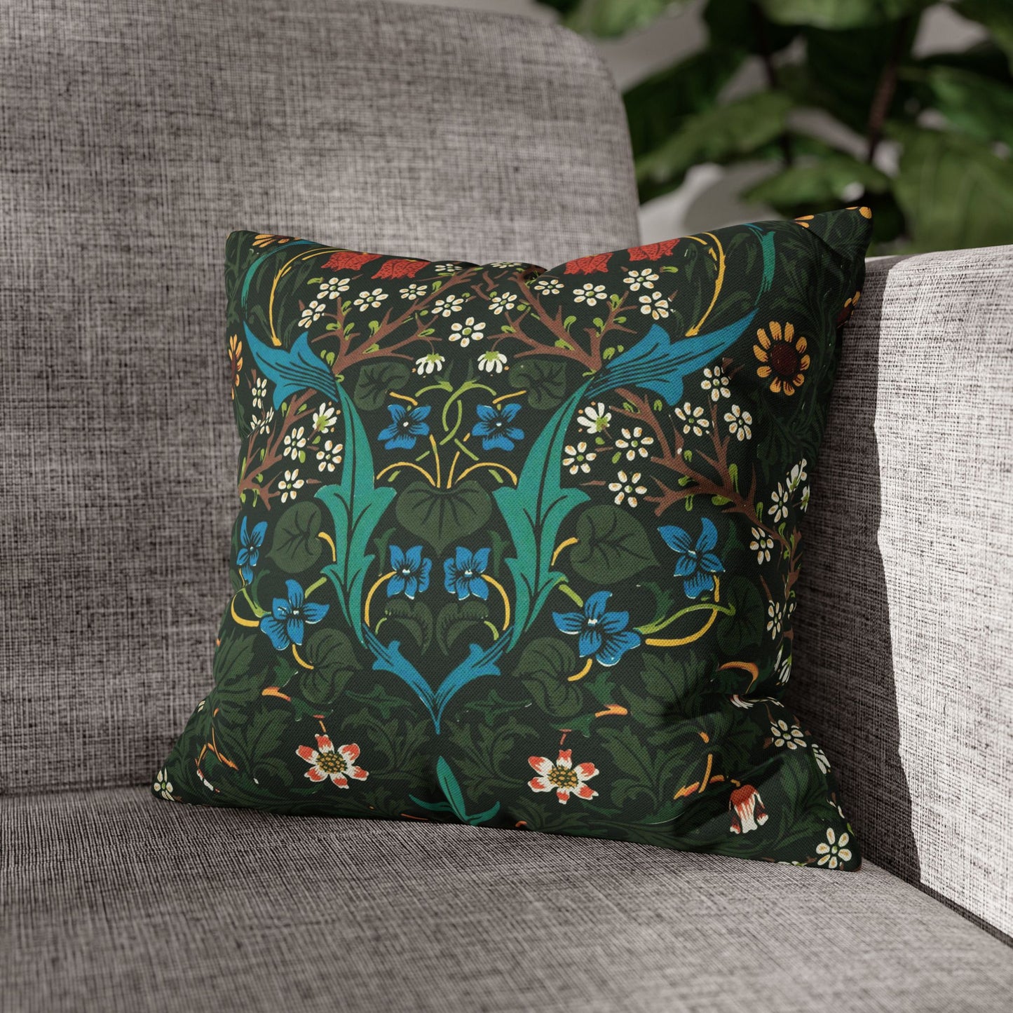 Decorative pillow with floral pattern on a gray couch - William Morris Tulip