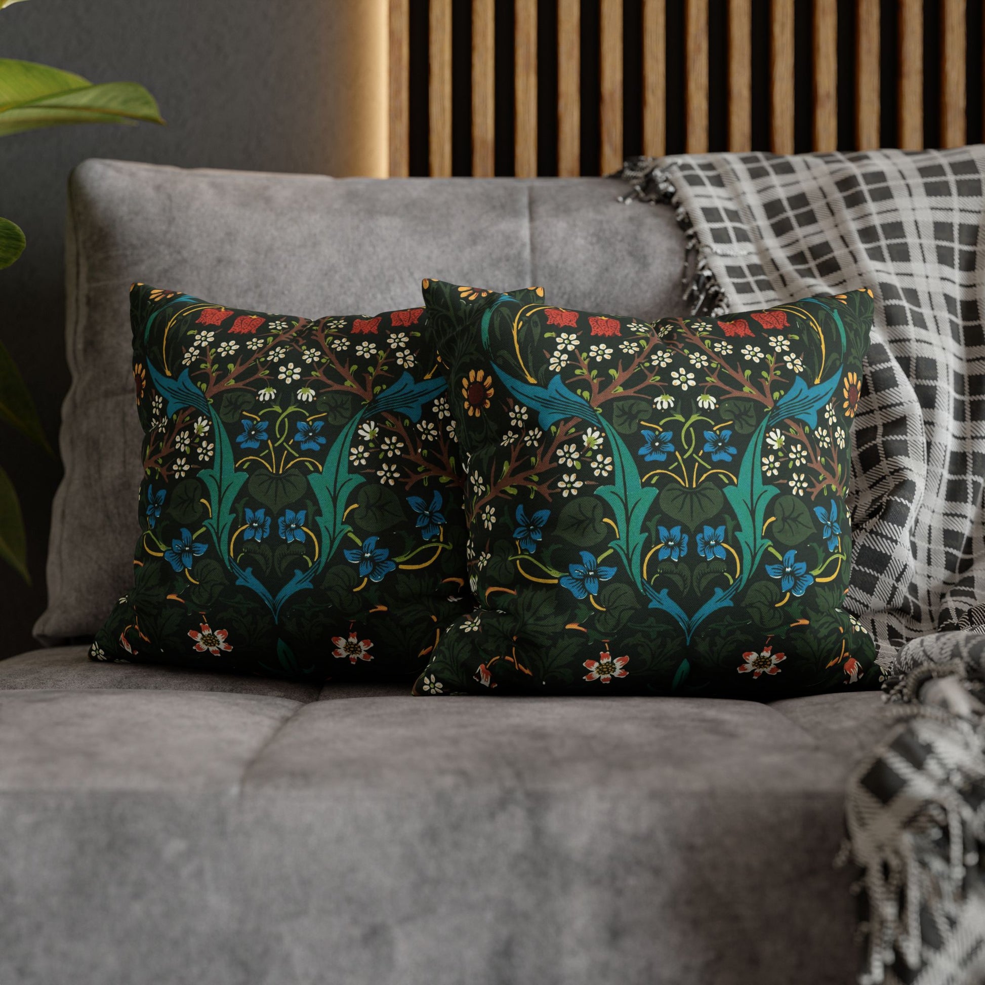Decorative pillows with floral patterns on a gray sofa - William Morris Tulip.