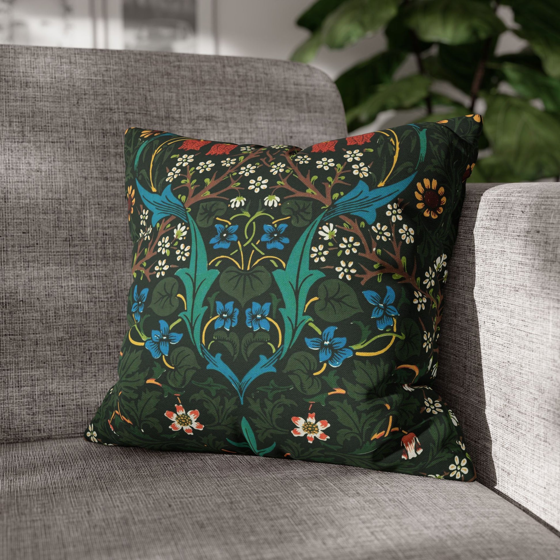 Decorative pillow with floral pattern on a gray sofa - William Morris Tulip