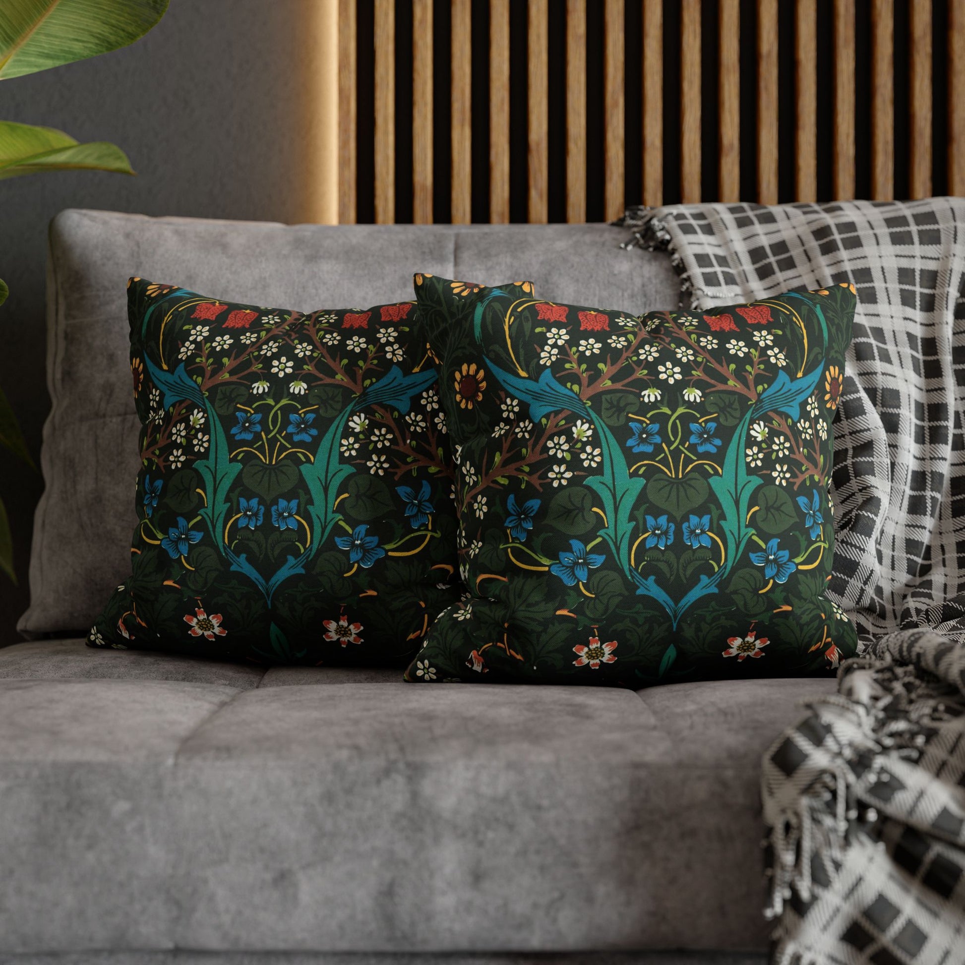 Decorative pillows with floral patterns on a gray sofa - William Morris Tulip