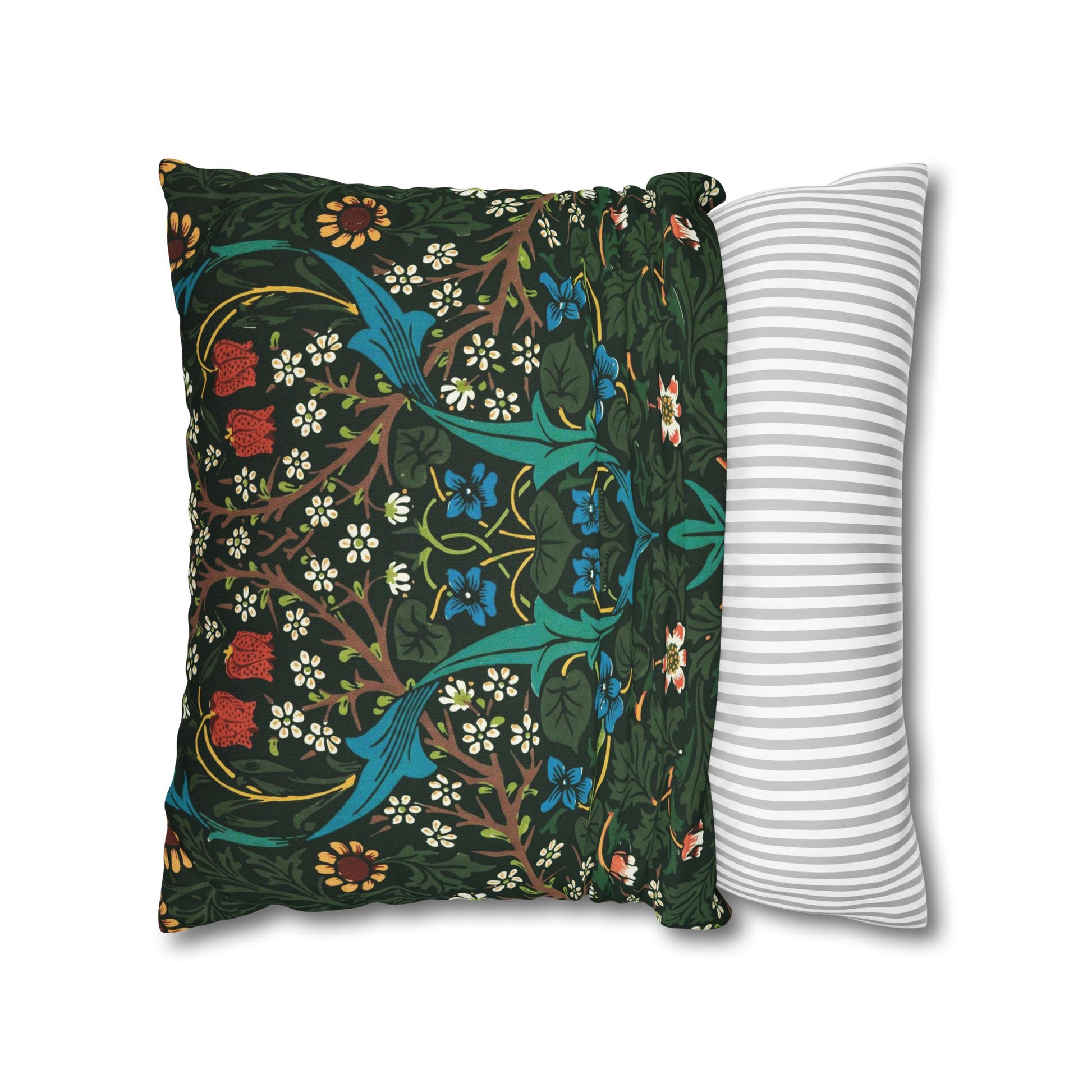 Decorative pillow with floral pattern next to a striped pillow on a white background - William Morris Tulip