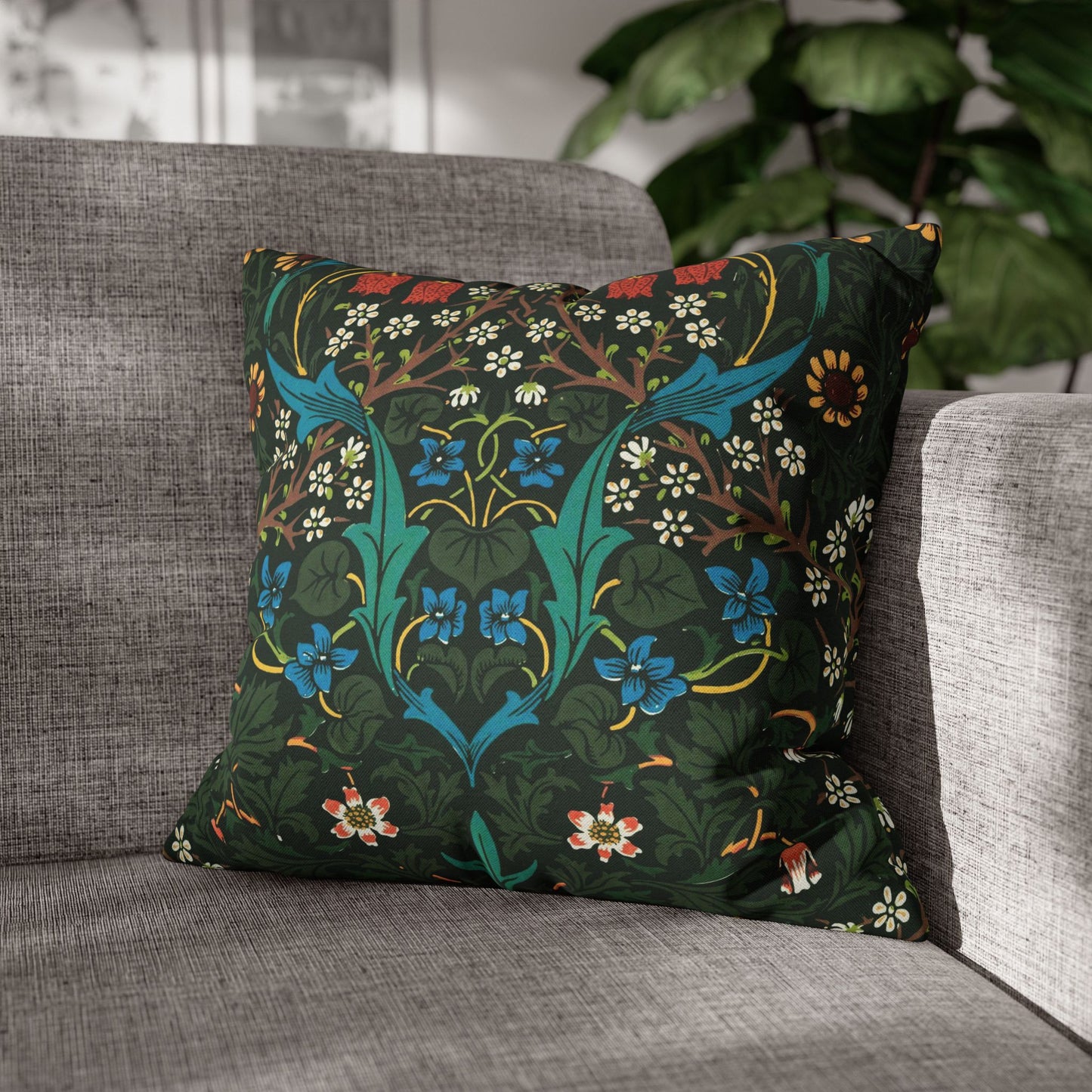Decorative pillow with floral pattern on a gray sofa - William Morris Tulip