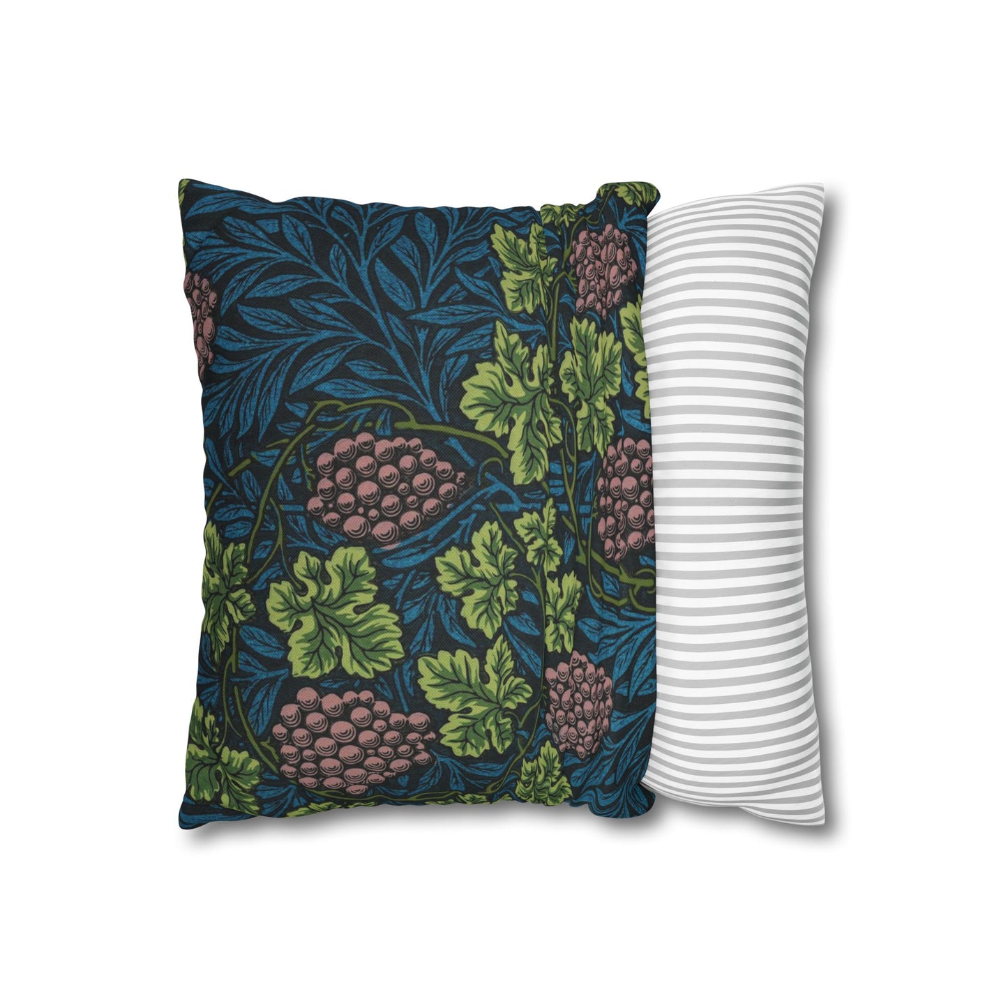 Decorative pillow with floral pattern next to a striped pillow on a white background