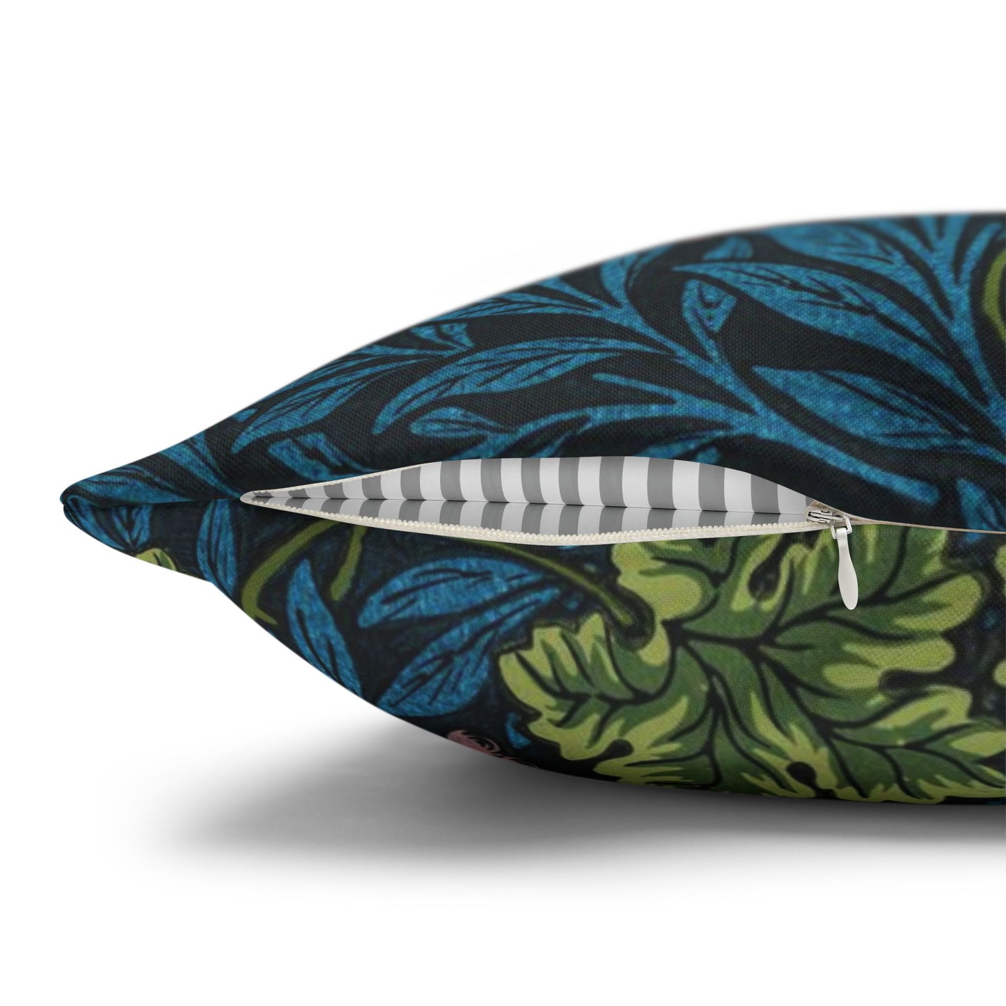 Floral-patterned pillow with a zipper on a white background