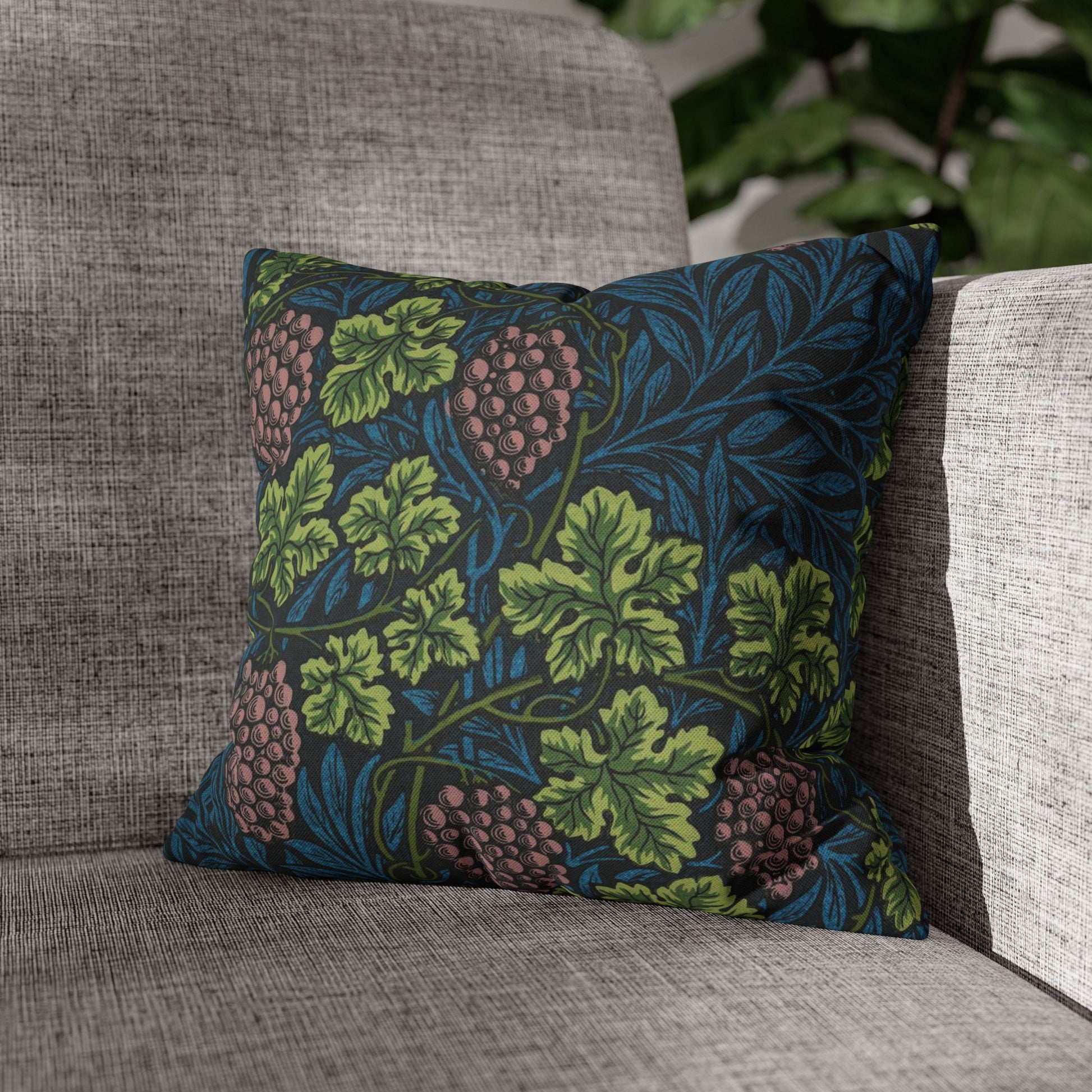 Decorative pillow with leaf pattern on a gray sofa