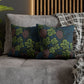 Decorative pillows with floral pattern on a gray sofa